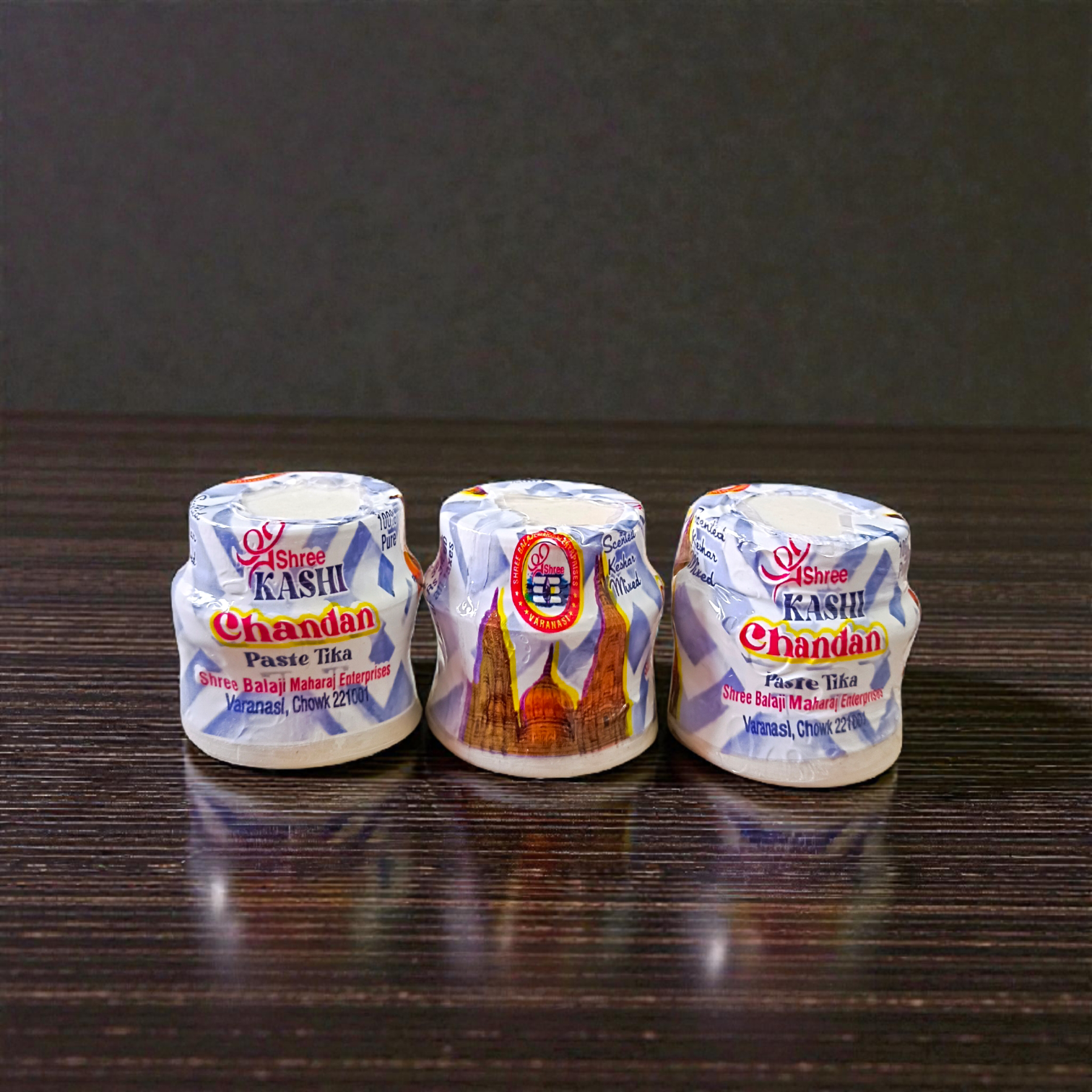 White chandan paste container used for tilak, puja, and religious rituals