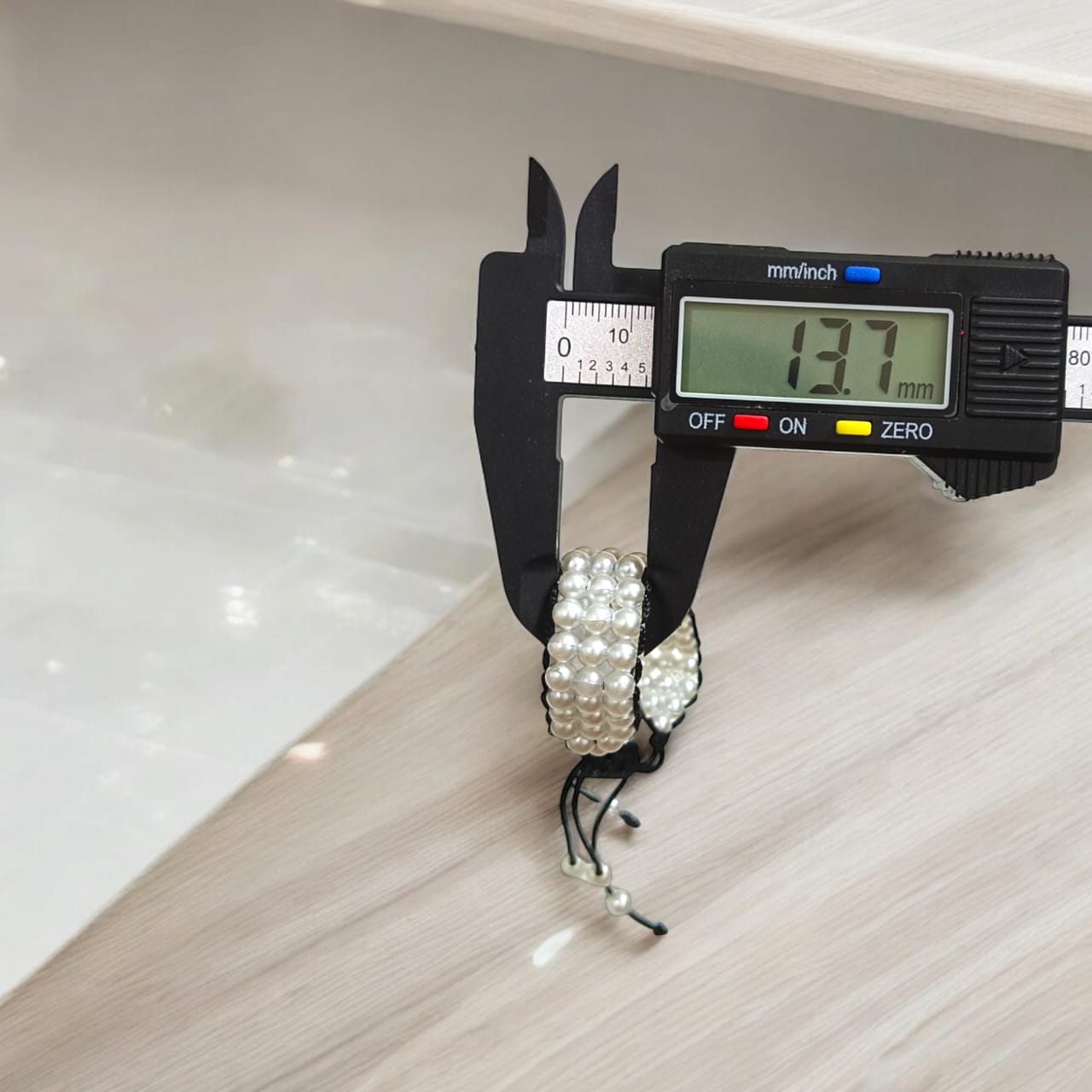 White pearl bracelet with adjustable sliding knot clasp, designed for girls and women, perfect for adding elegance to any outfit.