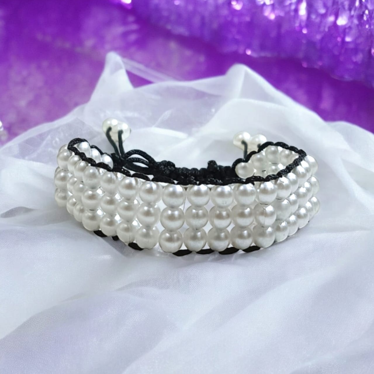 White pearl bracelet with adjustable sliding knot clasp, designed for girls and women, perfect for adding elegance to any outfit.