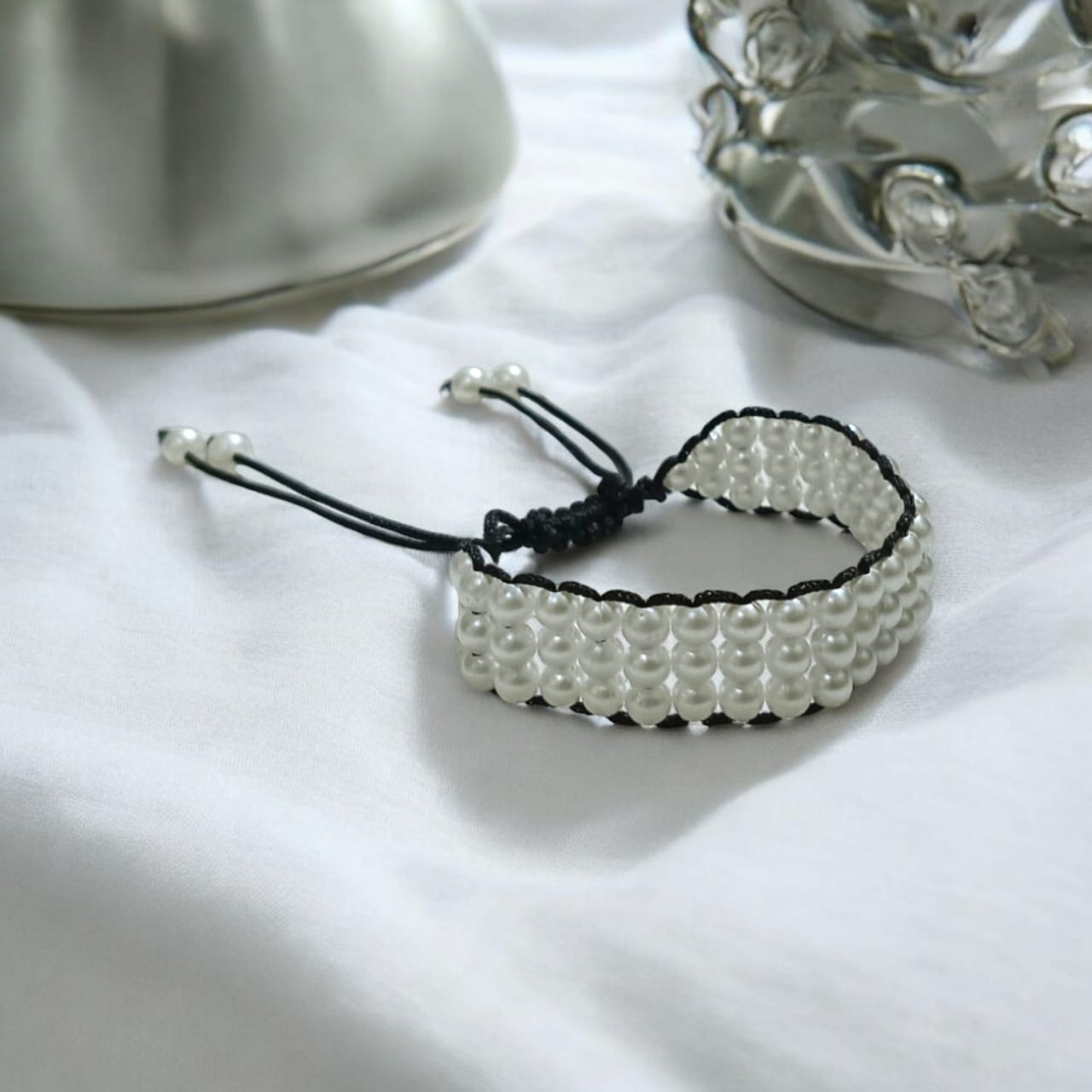 White pearl bracelet with adjustable sliding knot clasp, designed for girls and women, perfect for adding elegance to any outfit.