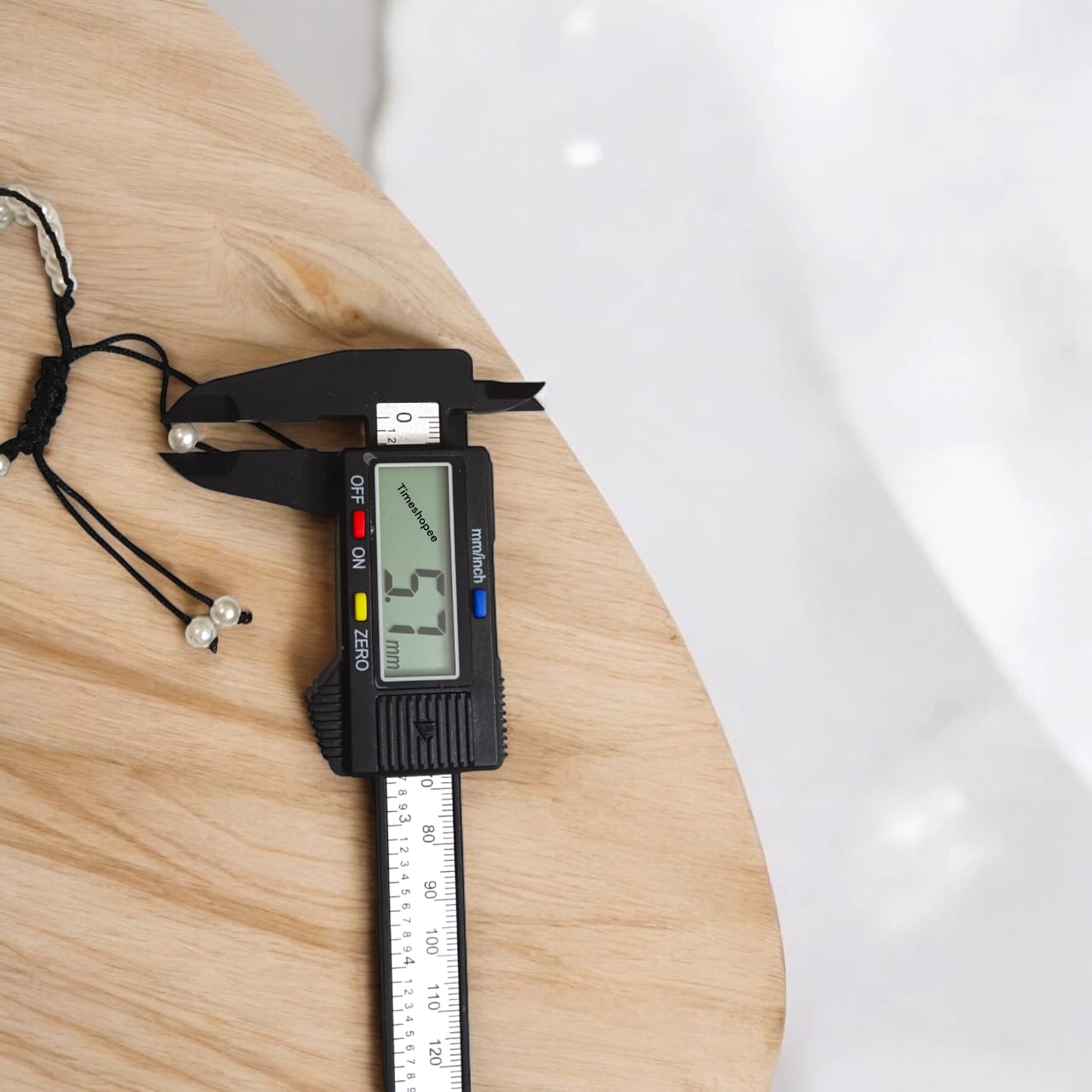 White pearl bracelet with adjustable sliding knot clasp, designed for girls and women, perfect for adding elegance to any outfit.