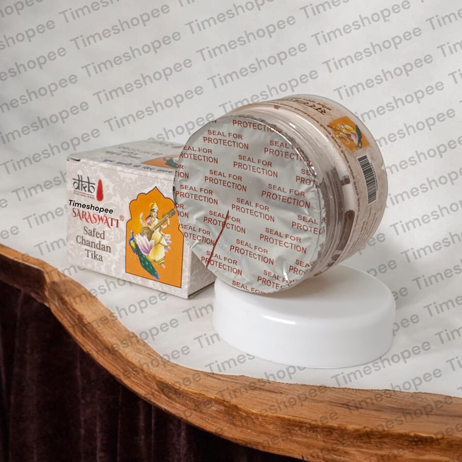 White sandalwood paste in a container, used for tilak, puja, and daily religious rituals, with a long-lasting fragrance.