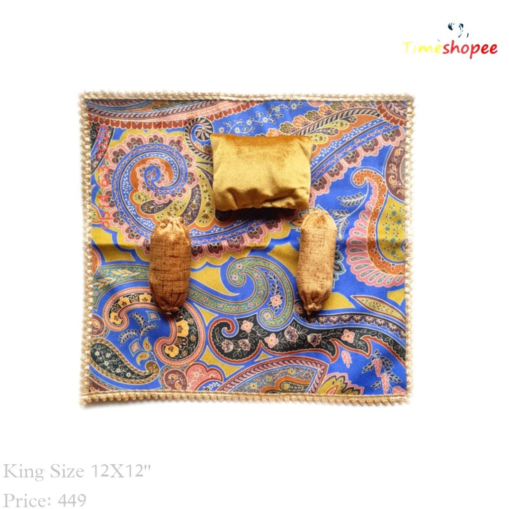 A luxurious 12X12 inch premium velvet bedsheet set with a pillow and blanket for Laddu Gopal, available in six stylish designs, ensuring comfort and elegance in your pooja area.