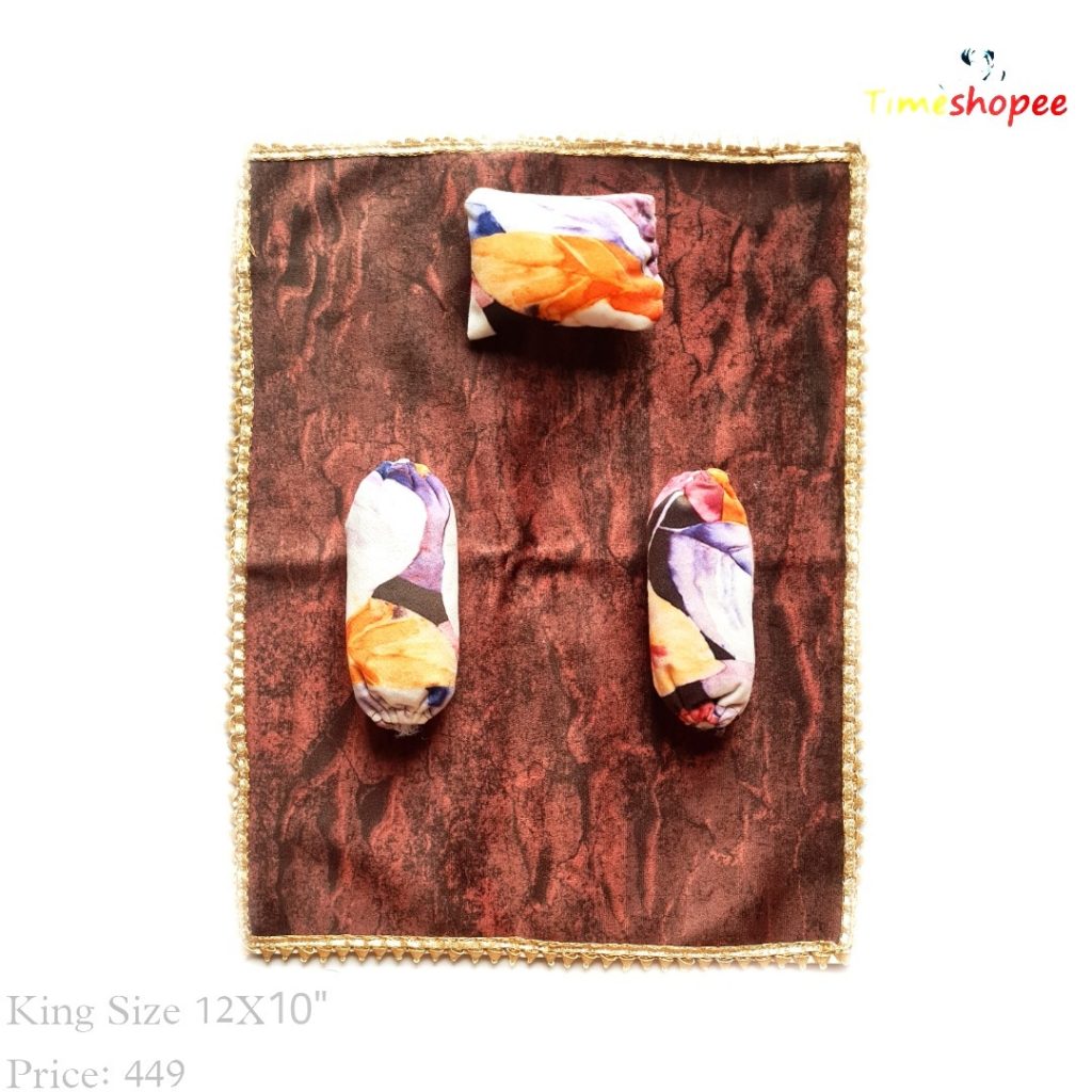 A luxurious 12X12 inch premium velvet bedsheet set with a pillow and blanket for Laddu Gopal, available in six stylish designs, ensuring comfort and elegance in your pooja area.