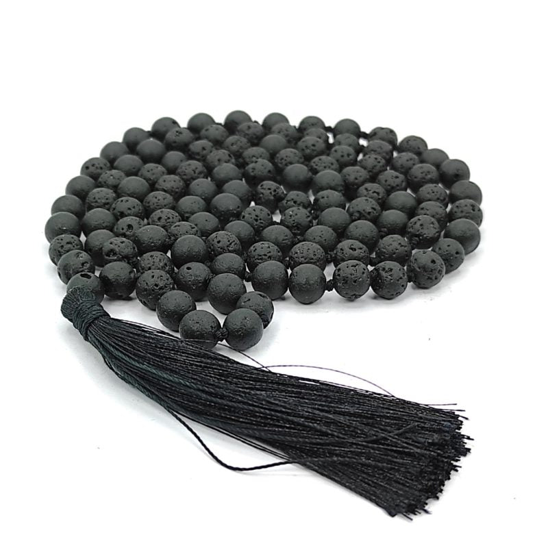 Natural Lava Mala with 108+1 volcanic beads, black porous texture, ideal for spiritual healing, placed on a white background