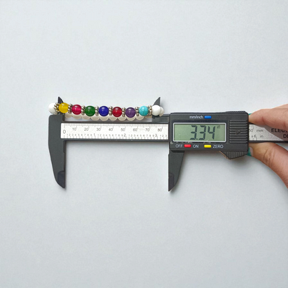 7 Chakra with Howlite Bracelet featuring colorful chakra stones and white howlite beads on an elastic thread, spiritual jewelry for men and women