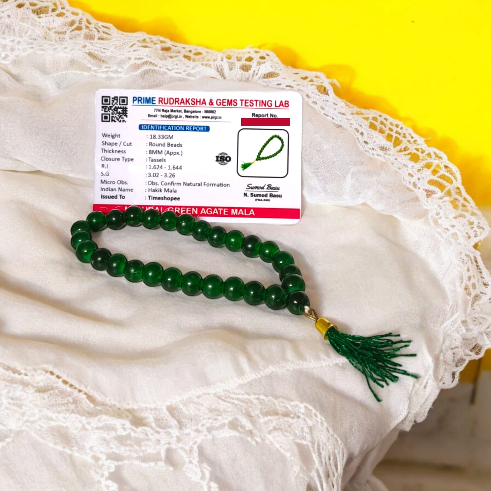 A 27+1 bead green agate mala, each bead measuring 8mm, shown with its lab certification. Ideal for meditation, wearing, or placement in car and office.