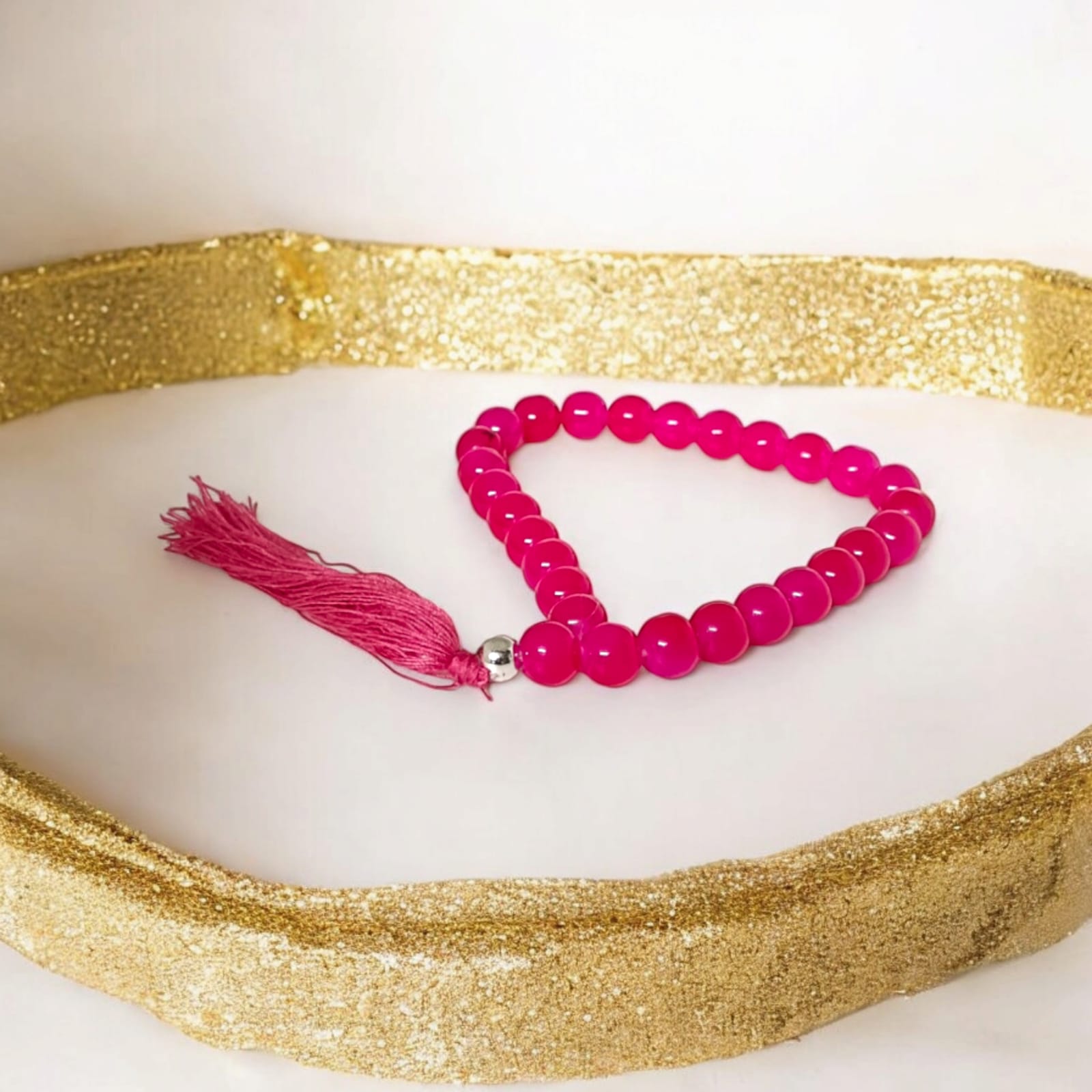 A 27+1 bead pink agate mala, each bead measuring 8mm, shown with its lab certification. Ideal for meditation, wearing, or enhancing positive energy in car and office.