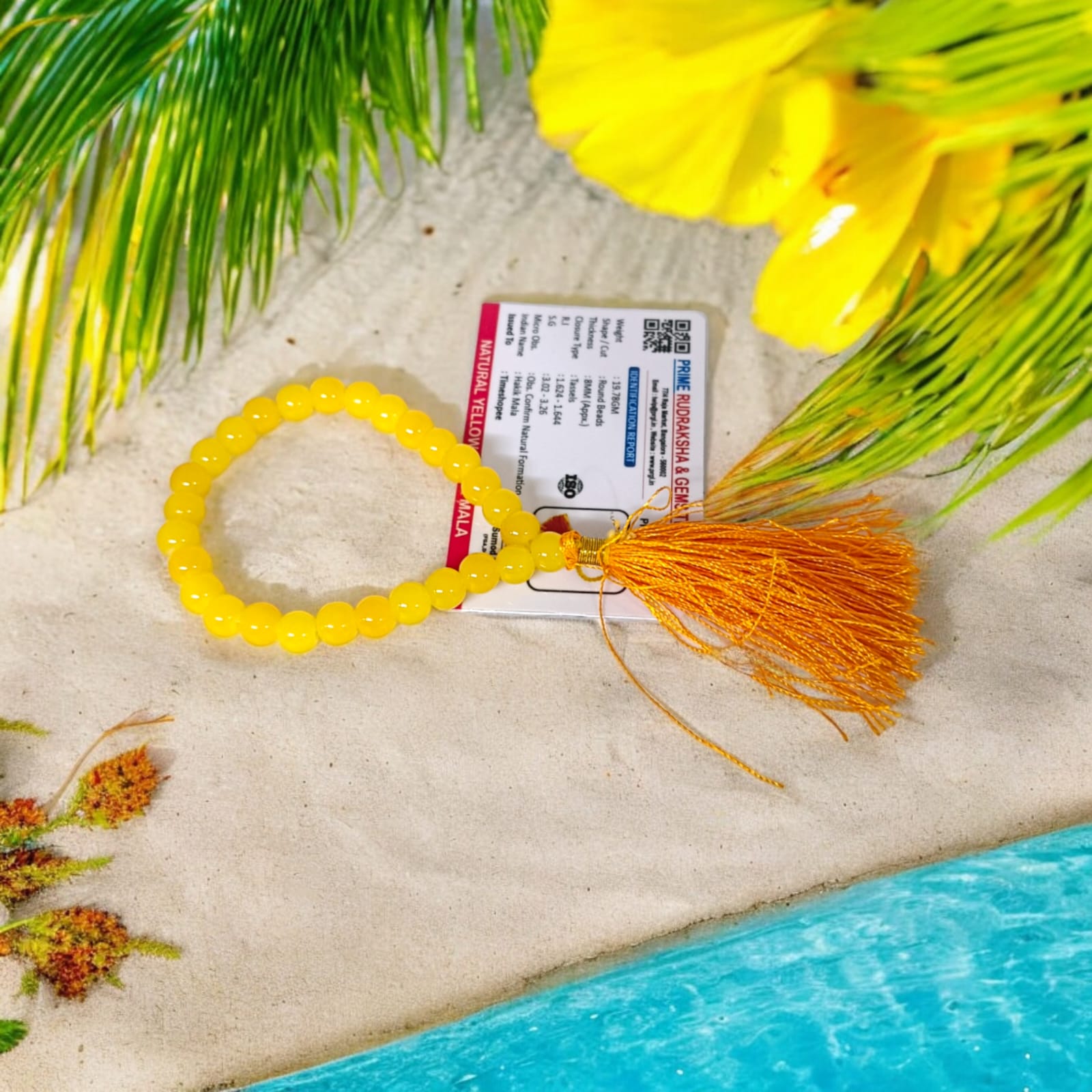 A 27+1 bead yellow agate mala, each bead measuring 8mm, displayed with its lab certification. The mala is ideal for wearing, meditation, or keeping in cars and offices.
