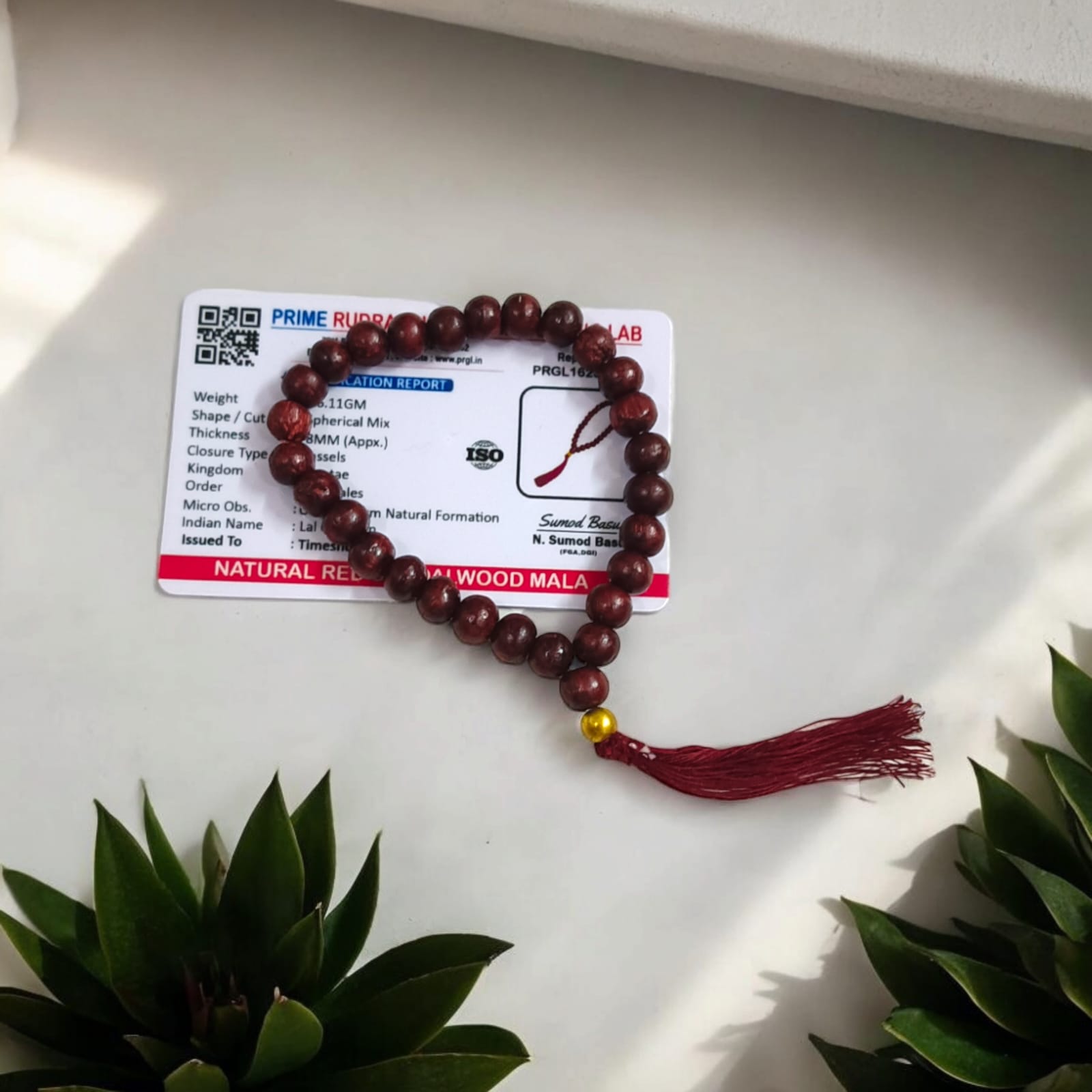 A Lal Chandan Mala with 27+1 lab-certified Red Sandalwood beads, each 8MM in size, ideal for mantra chanting and meditation, suitable for car, office, and travel.