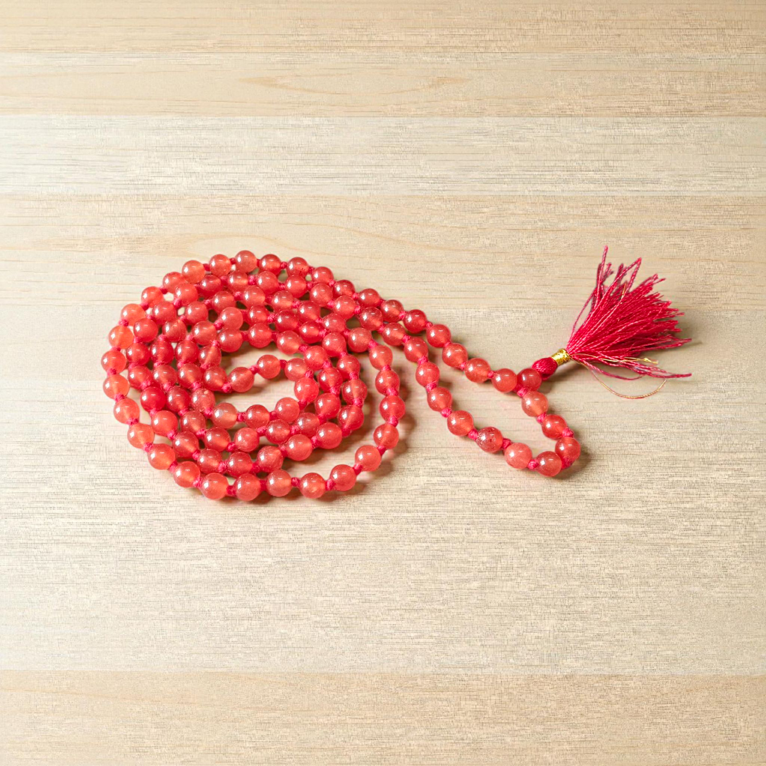 A Hessonite (Gomed) Mala with 27+1 lab-certified deep red gemstone beads, each 8MM in size, designed for meditation, focus, and astrological benefits, ideal for travel, office, and car.