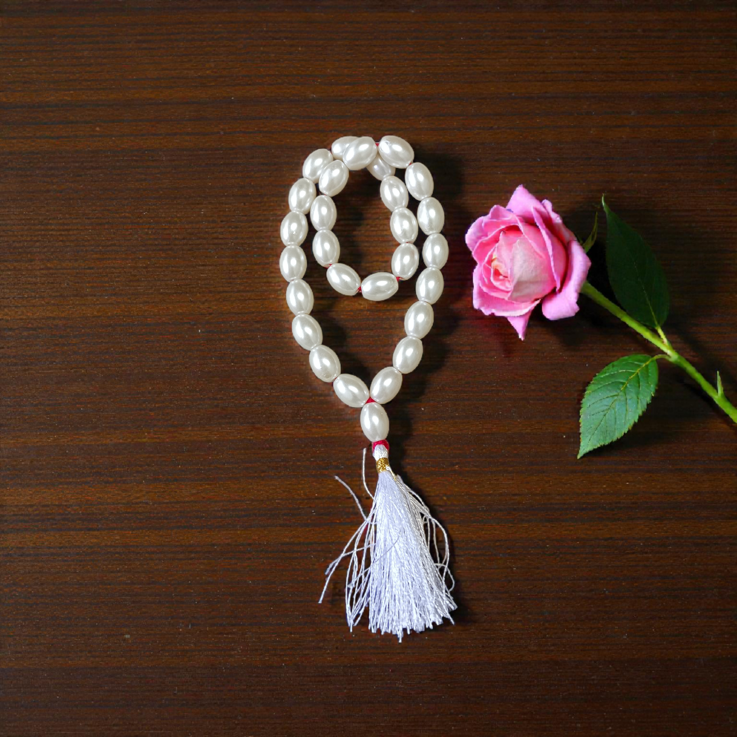 A beautiful Natural Pearl Mala with 108+1 white round beads (10-11mm), handcrafted and lab-certified, ideal for meditation and Japa rituals