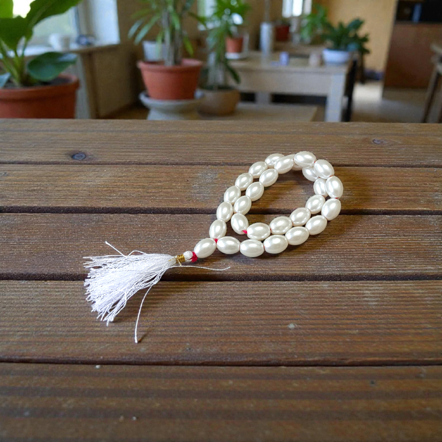 A beautiful Natural Pearl Mala with 108+1 white round beads (10-11mm), handcrafted and lab-certified, ideal for meditation and Japa rituals