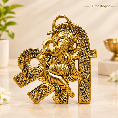 A beautifully crafted brass wall hanging of Shri Ganesh, measuring 11X11 CM, suitable for decorating temple walls, office spaces, and home doors.
