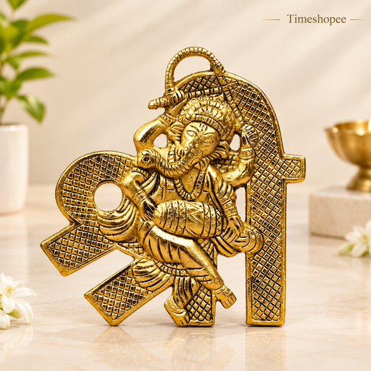 A beautifully crafted brass wall hanging of Shri Ganesh, measuring 11X11 CM, suitable for decorating temple walls, office spaces, and home doors.