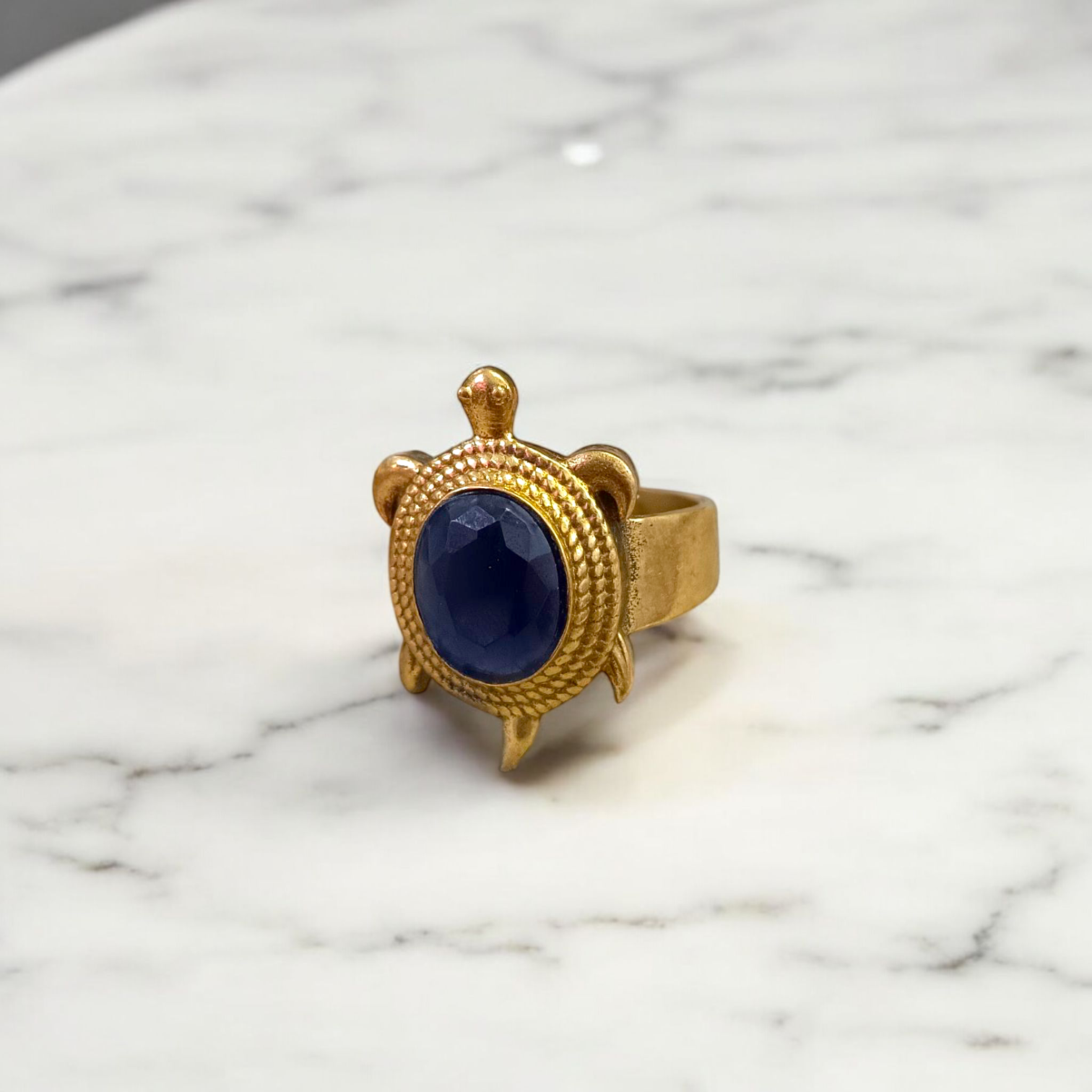 A close-up of the Kachua Black Hakik Ring, showcasing a deep black Kala Hakik (Black Agate) gemstone set in a tortoise-shaped design made from Ashtdhatu. The ring is adjustable and suitable for both men and women.