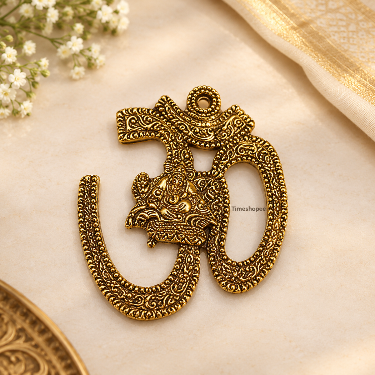 A decorative brass wall hanging featuring the sacred Om symbol, measuring 4X5 inches, suitable for temples, offices, and home walls to promote spirituality.