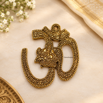 A decorative brass wall hanging featuring the sacred Om symbol, measuring 4X5 inches, suitable for temples, offices, and home walls to promote spirituality.