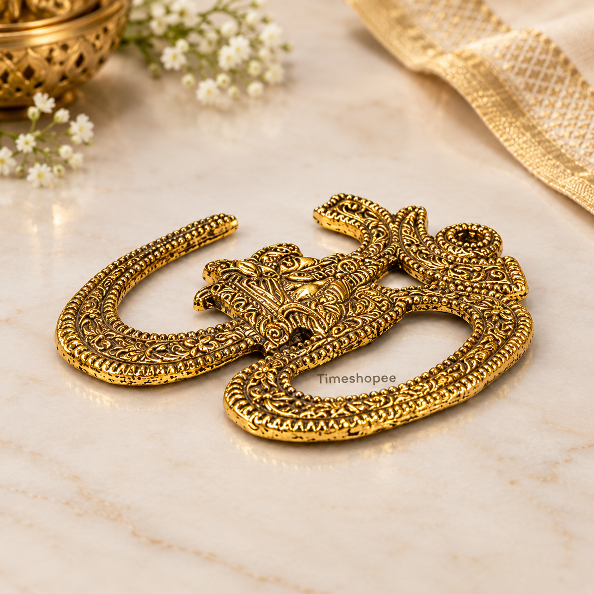 A decorative brass wall hanging featuring the sacred Om symbol, measuring 4X5 inches, suitable for temples, offices, and home walls to promote spirituality.
