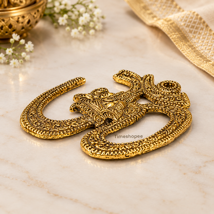 A decorative brass wall hanging featuring the sacred Om symbol, measuring 4X5 inches, suitable for temples, offices, and home walls to promote spirituality.