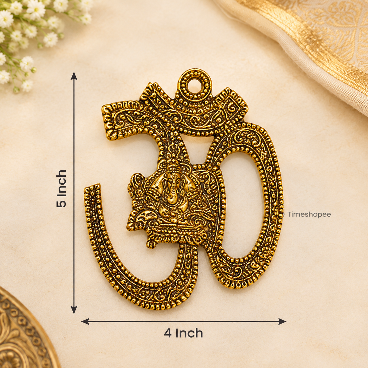 A decorative brass wall hanging featuring the sacred Om symbol, measuring 4X5 inches, suitable for temples, offices, and home walls to promote spirituality.