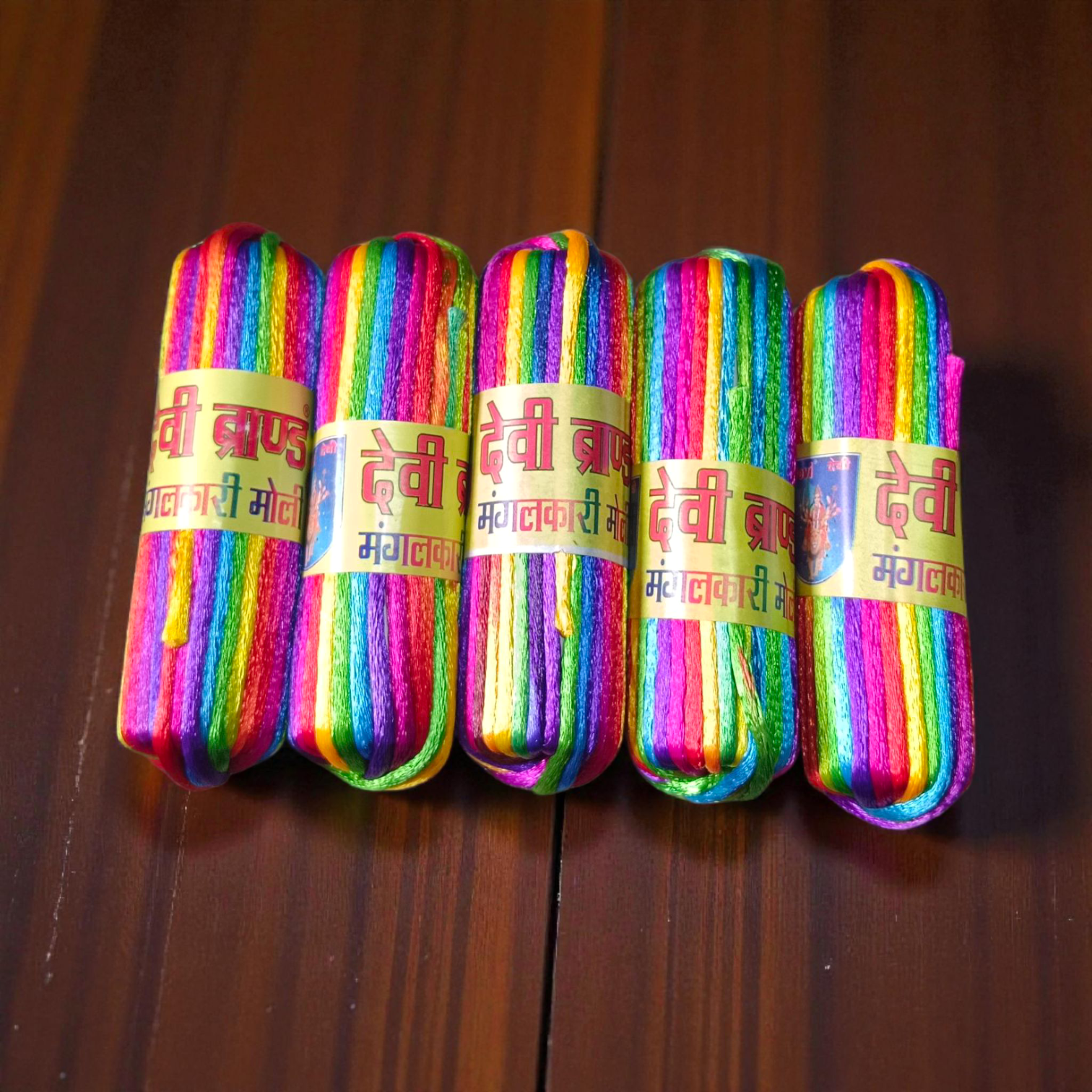 A pack of 5 colorful silk moli threads, each 11 feet long, traditionally used in Hindu pooja rituals for protection, blessings, and mannat dhaga ceremonies