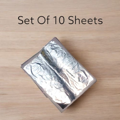 A set of 10 pure silver leaves (Chandi Vark) used for decorating offerings in religious ceremonies, particularly during Hanuman Ji worship.