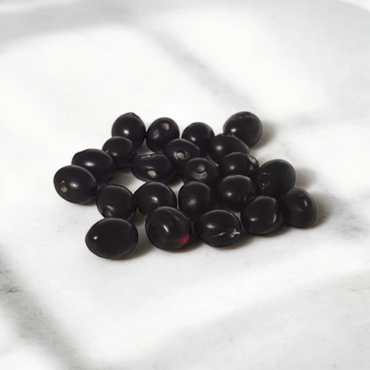 A set of 21 lab-certified Gunja seeds in red, white, and black, featuring loose beads ideal for spiritual use, crafting, or decoration.