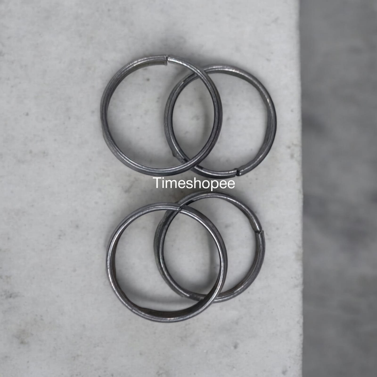 A set of four Ghode Ki Naal ka Challa rings made from black horse shoe nails, each ring designed to mitigate the negative effects of Saturn (Shani). The rings are shown in a close-up view to highlight their craftsmanship and material.