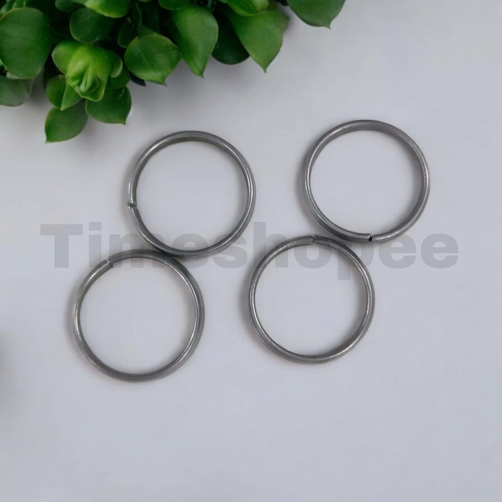 A set of four Ghode Ki Naal ka Challa rings made from black horse shoe nails, each ring designed to mitigate the negative effects of Saturn (Shani). The rings are shown in a close-up view to highlight their craftsmanship and material.