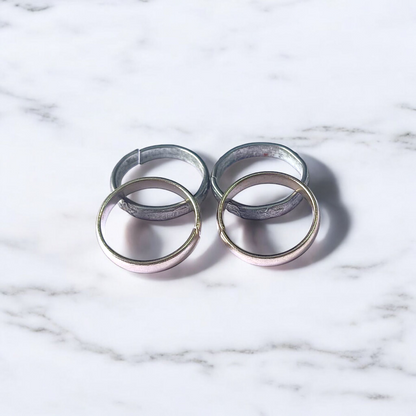 A set of four Ghode Ki Naal ka Challa rings made from black horse shoe nails, each ring designed to mitigate the negative effects of Saturn (Shani). The rings are shown in a close-up view to highlight their craftsmanship and material