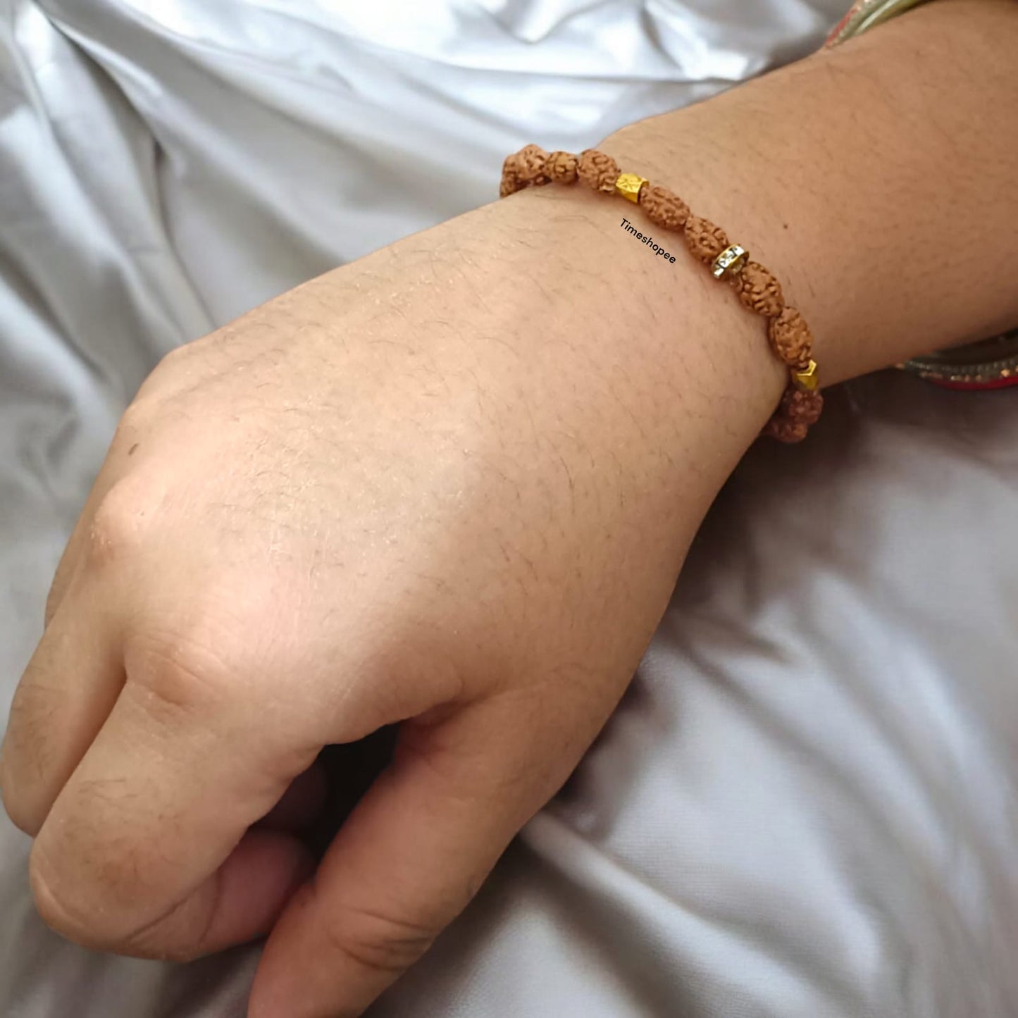 A stretchable 2 Mukhi Rudraksha bracelet featuring 8MM lab-certified beads designed to improve communication skills and promote clarity of thought.