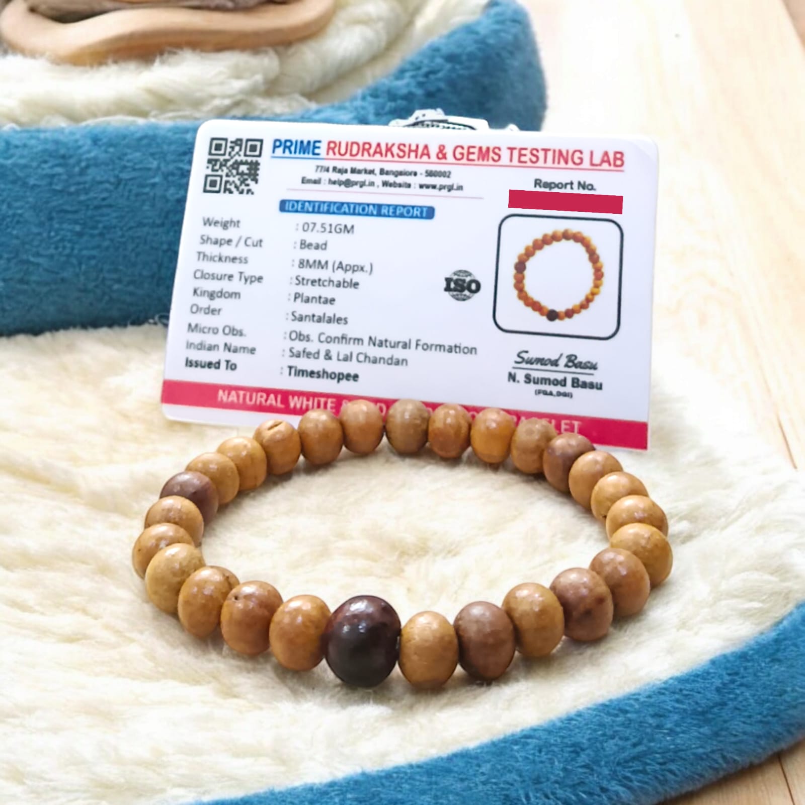 A beautiful Red & White Sandalwood Bracelet with 8MM lab-certified beads, showcasing its elegant design and spiritual significance.