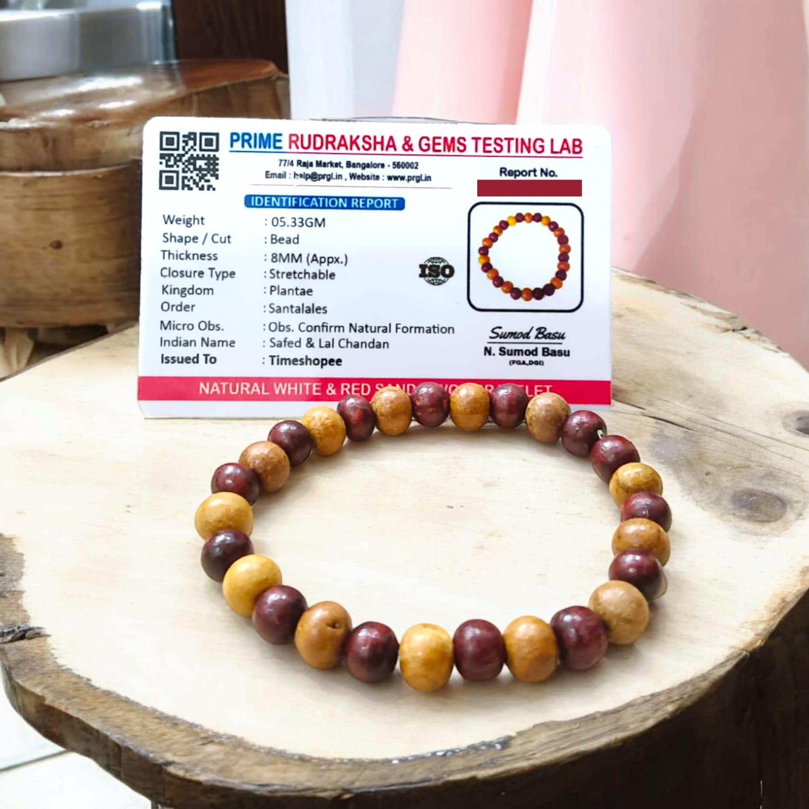 A beautiful Red & White Sandalwood Bracelet with 8MM lab-certified beads, showcasing its elegant design and spiritual significance.