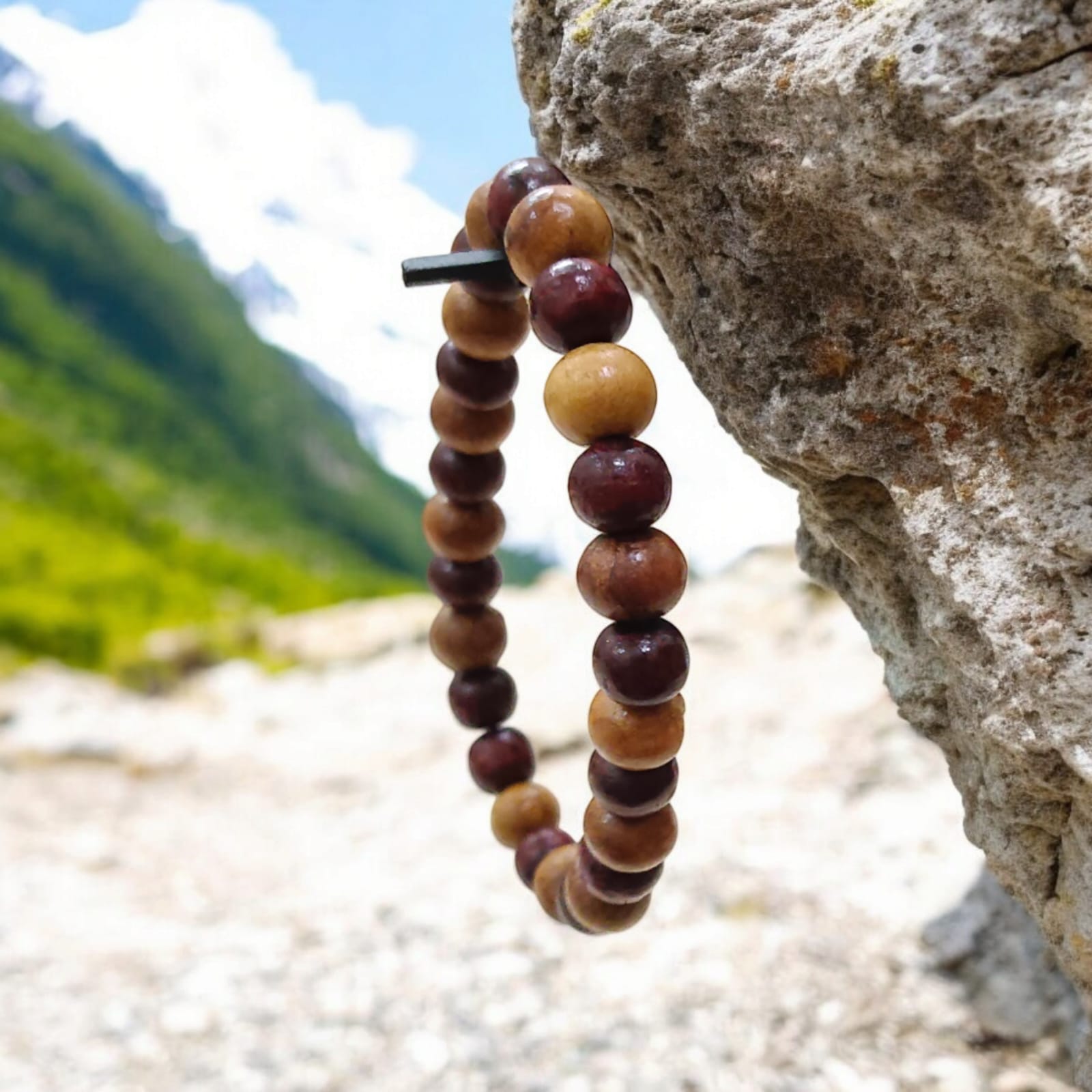 A beautiful Red & White Sandalwood Bracelet with 8MM lab-certified beads, showcasing its elegant design and spiritual significance.