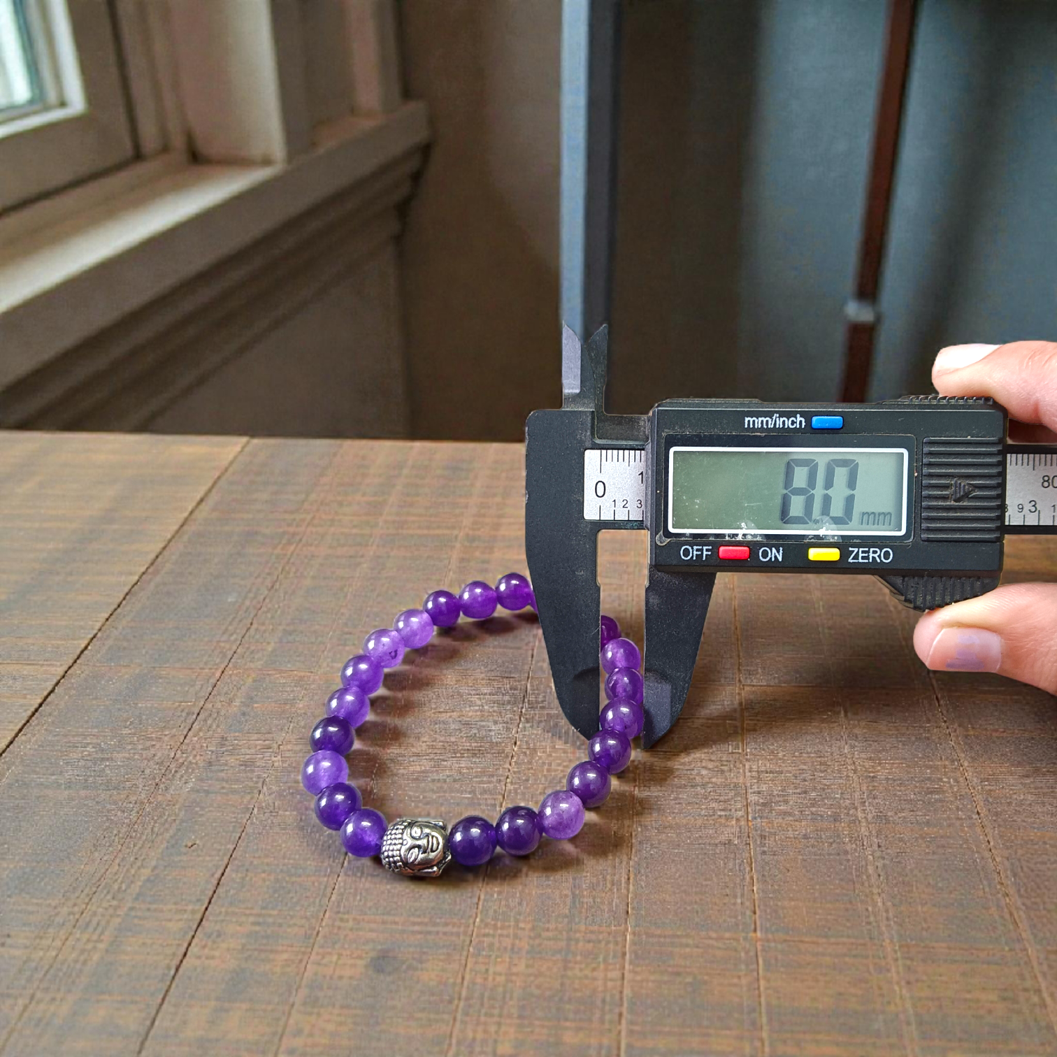 Amethyst bracelet with 8MM beads, showcasing its elegant design and lab certification
