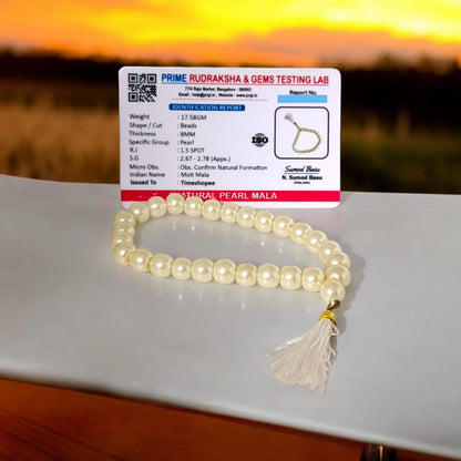 An elegant Pearl Mala featuring 27+1 original 8MM lab-certified pearls, arranged neatly for display.