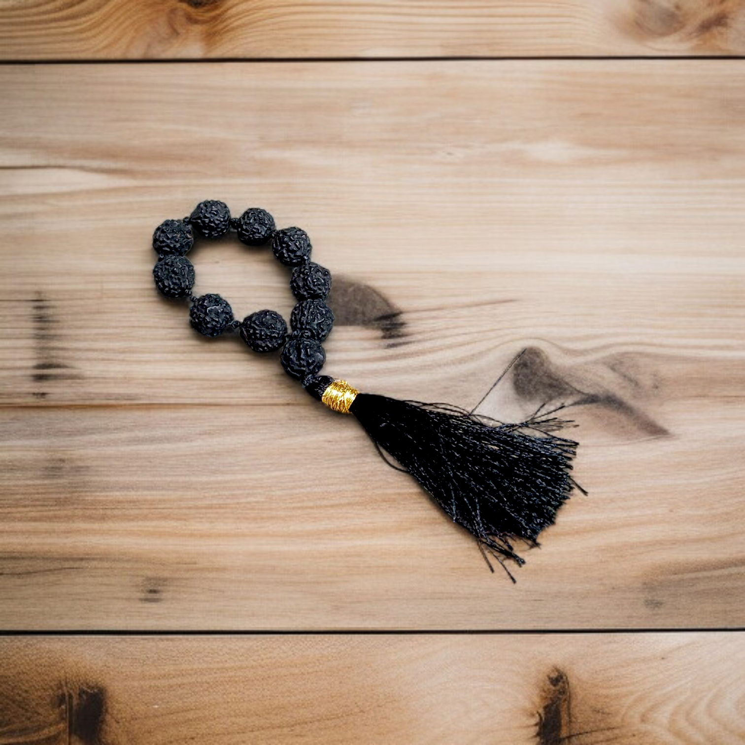 Black 5 Mukhi Rudraksha Mala with 108+1 natural beads, used for meditation and mantra chanting, displayed on a white background