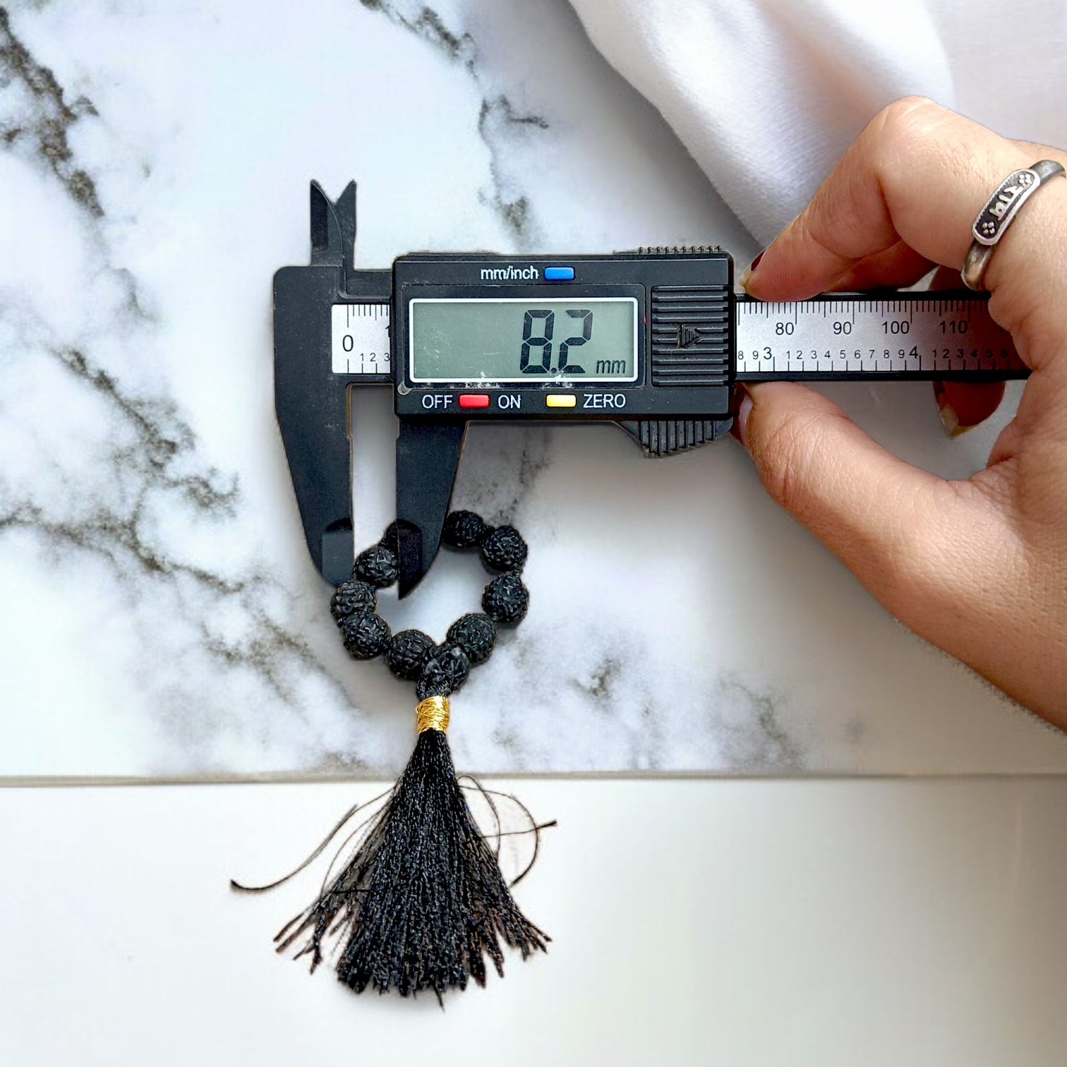 Black 5 Mukhi Rudraksha Mala with 108+1 natural beads, used for meditation and mantra chanting, displayed on a white background