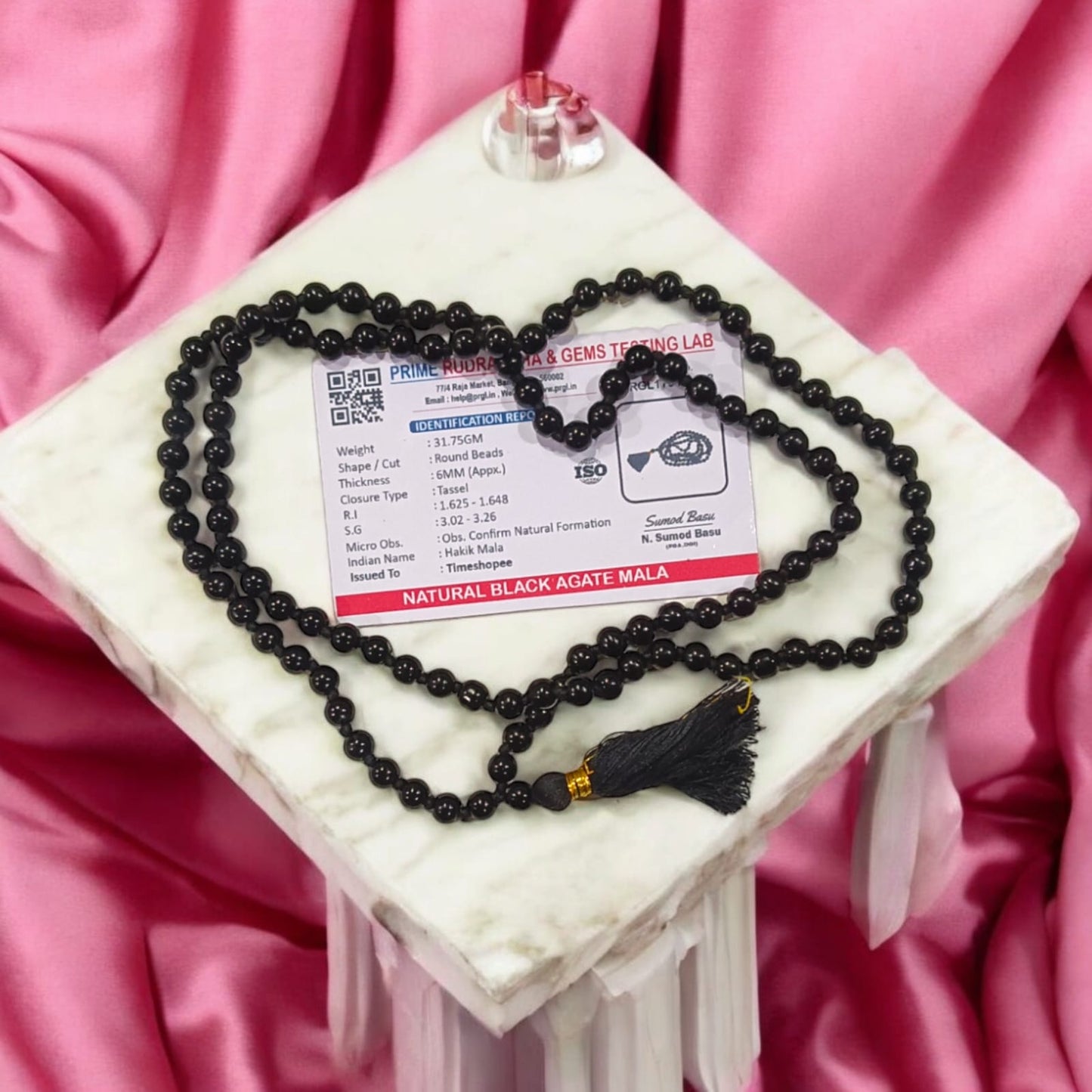 Black Hakik Mala with 6MM beads, 108+1 beads, lab-certified for authenticity, shown in a close-up view.