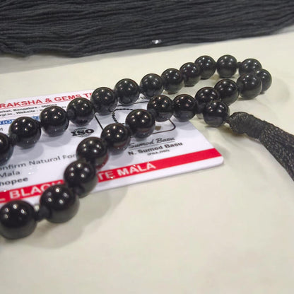 Black Hakik Mala with 8MM beads and 27+1 bead count, lab-certified for authenticity, shown in a convenient, easy-to-carry design.