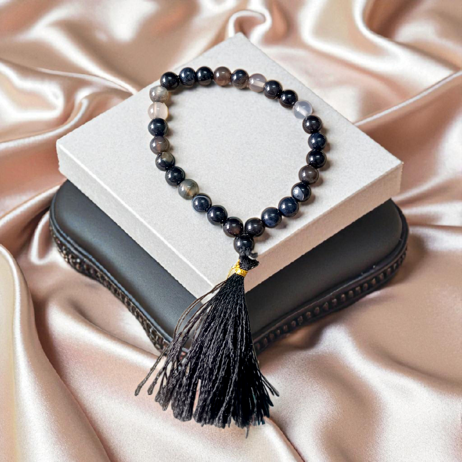 Close-up image of Natural Sulemani Hakik Mala (Black Agate) with 27+1 round beads, 8MM in size, used for Japa, meditation, and daily spiritual protection