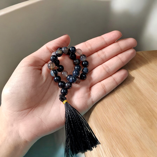 Close-up image of Natural Sulemani Hakik Mala (Black Agate) with 27+1 round beads, 8MM in size, used for Japa, meditation, and daily spiritual protection