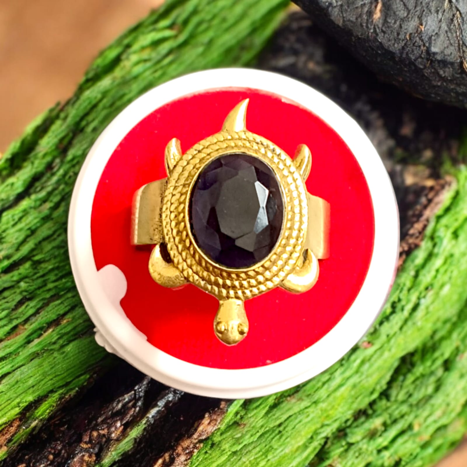 Close-up image of the Kachua Neelam Ring, showcasing a deep blue Neelam gemstone set in a tortoise-shaped design, made from Ashtdhatu. The ring is adjustable and suitable for men and women.