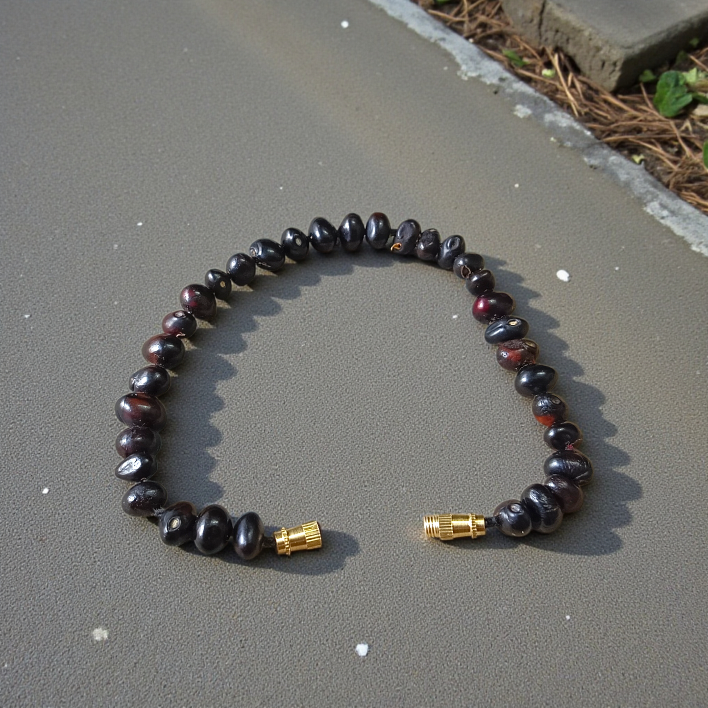 Combo of Black Gunja Bracelet and Red Gunja Bracelet with lab-certified natural beads, stretchable design for protection and energy
