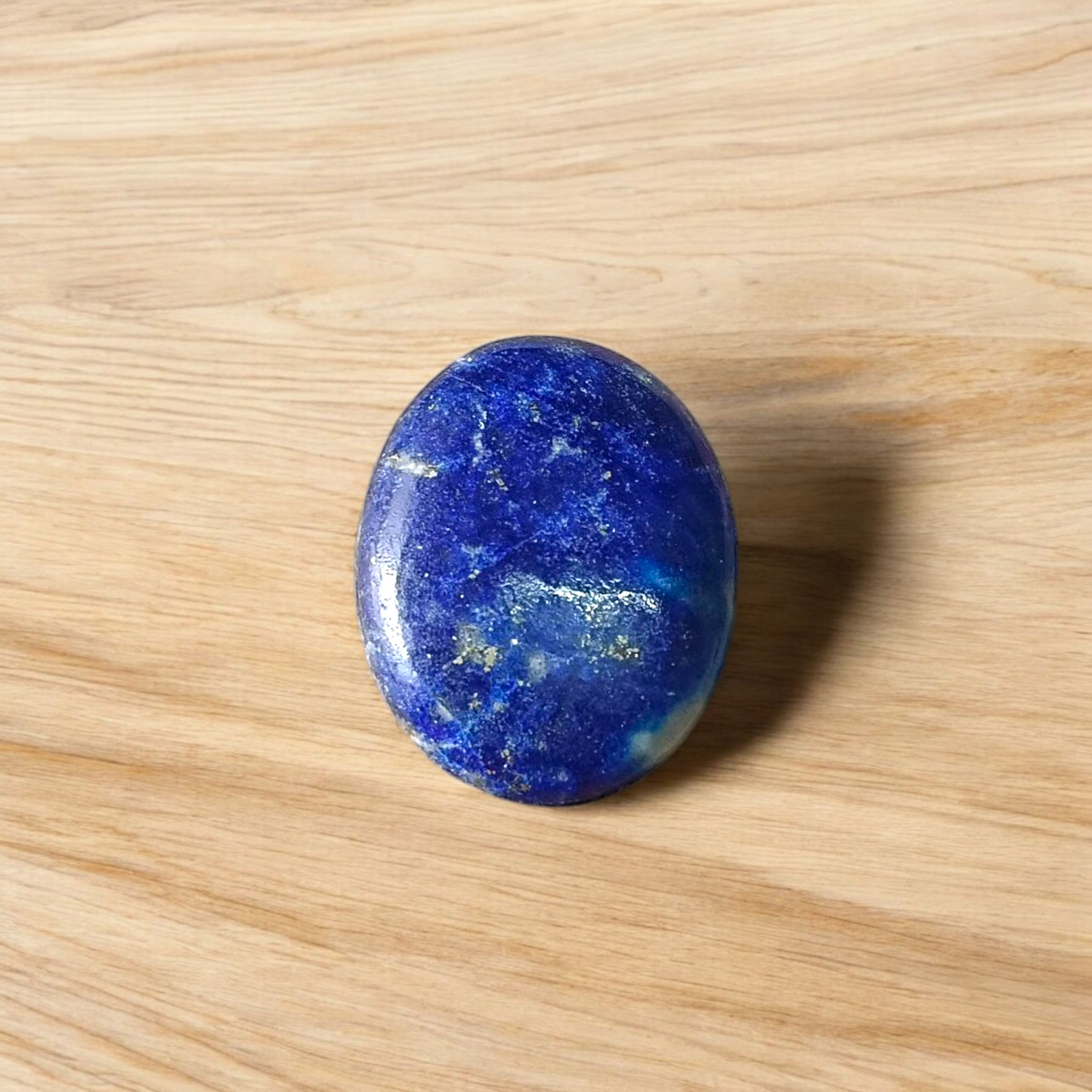 Deep blue Lapis Lazuli stone with golden flecks, used for mental clarity and emotional healing