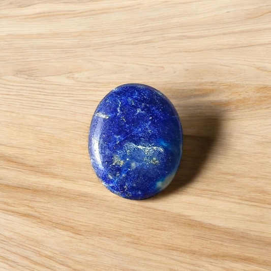 Deep blue Lapis Lazuli stone with golden flecks, used for mental clarity and emotional healing