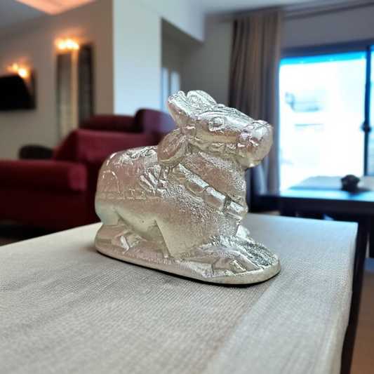 Image of a Natural Parad Nandi Idol made from mercury alloy, placed on a clean surface, reflecting divine and traditional craftsmanship