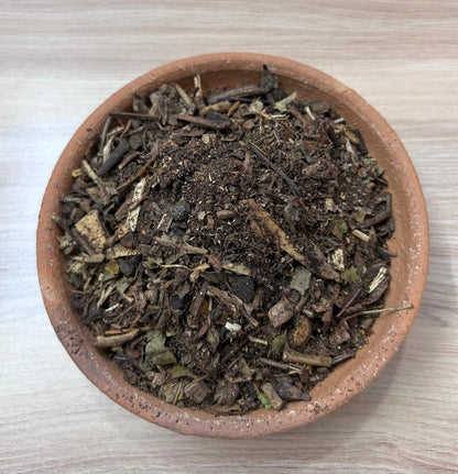 Image showing a 500GM pack of Hawan Samagri containing colorful natural herbs and powders used for Vedic rituals, placed beside puja essentials