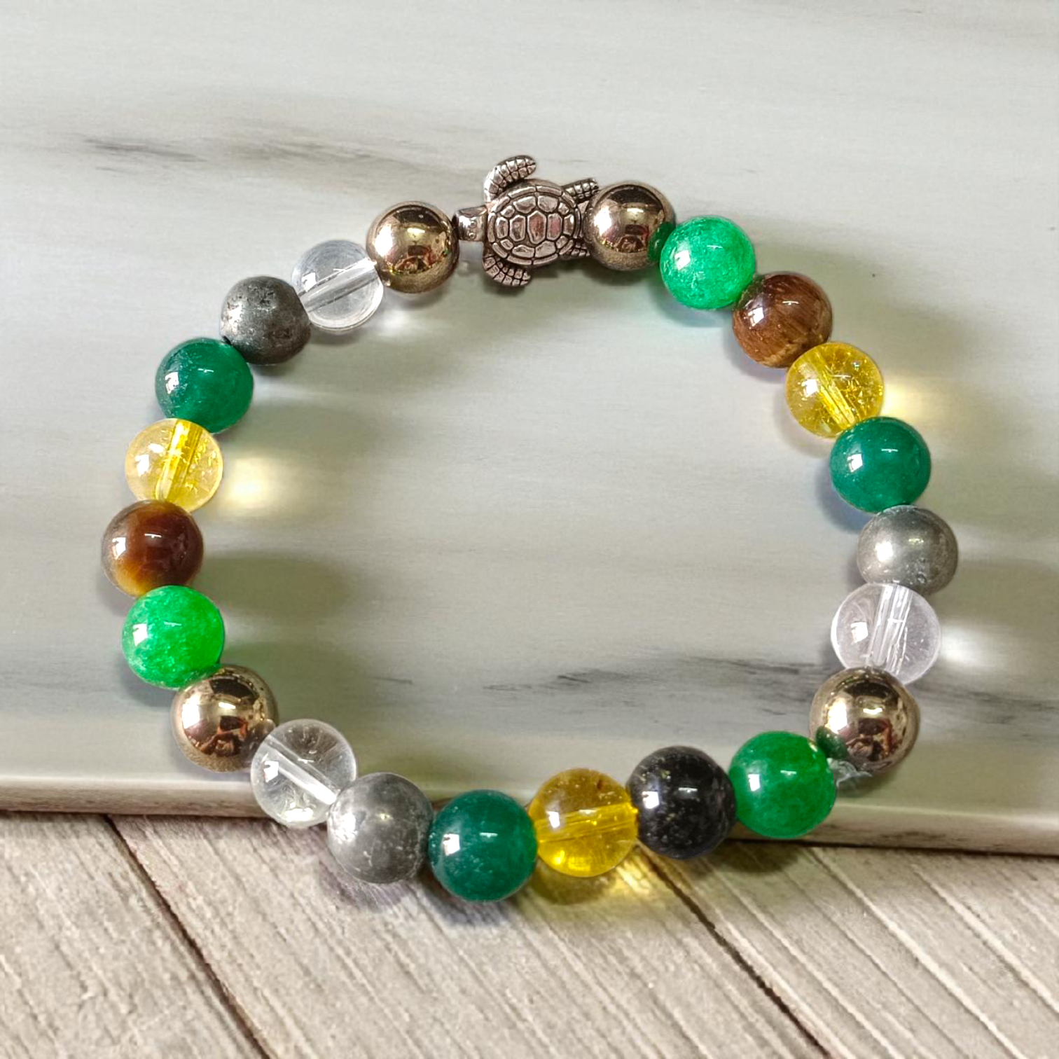 Image showing a stylish 8mm bead Money Magnet Bracelet with stretchable band, ideal for daily wear or gifting, placed on a clean background